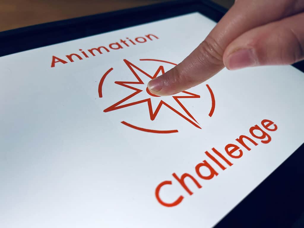 A photo of an ipad with a graphic on it that says "Animation Challenge"