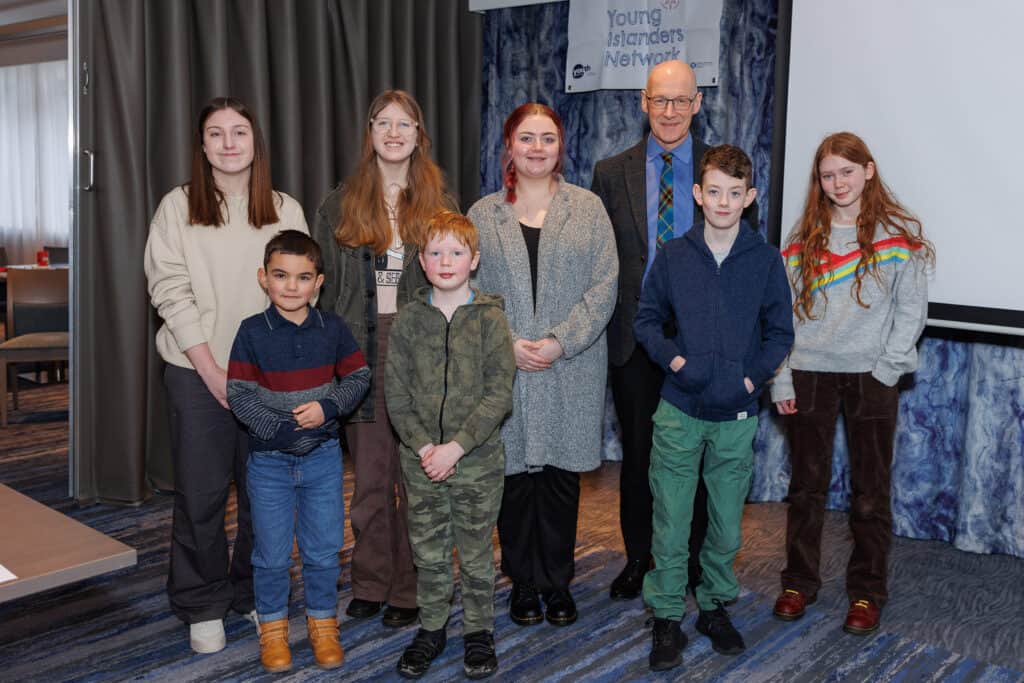 young islanders and mr swinney in group photo. 